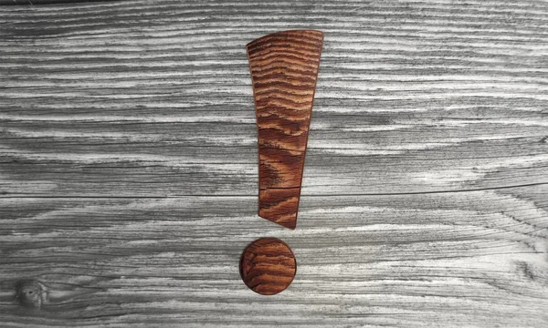 Brązowy uwagę symbol tło drewniane — Zdjęcie stockowe