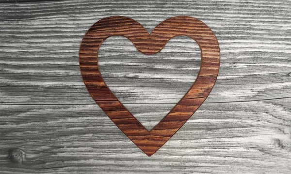 Sustainable heart symbol in a wooden background — Stock Photo, Image