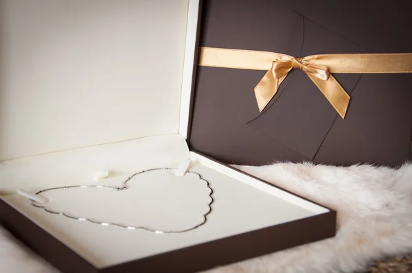 Valentines day gift - White gold necklace in a shape of heart — Stock Photo, Image