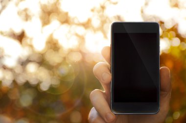 akıllı telefon, arka plan bulanık tutan el