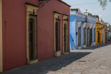 OAXACA, OAXACA, MEXICO- MAY 26, 2022: Colorful houses at the street in a sunny day at Oaxaca, Mexico