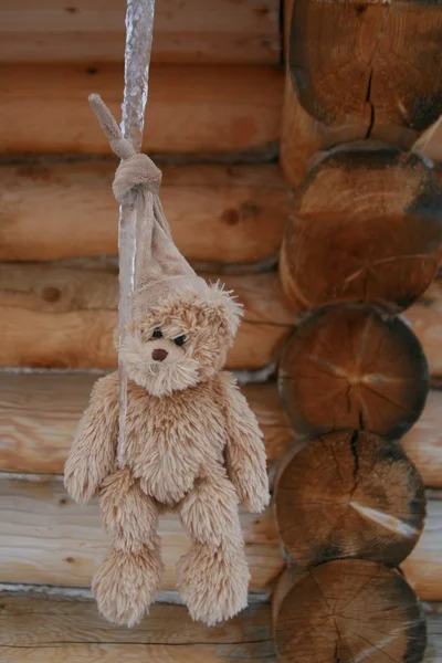 Teddy bear hanging on the icicle — Stock Photo, Image