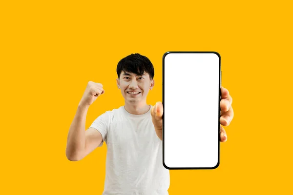 Asian Man Holding Smartphone White Empty Screen Yellow Background 모바일 — 스톡 사진