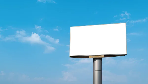 Blank billboard with empty screen over blue sky cloud background. For advertisement design or text. mockup template