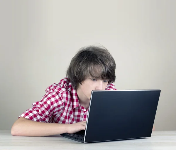 Boy working playing on laptop computer — Stock Photo, Image