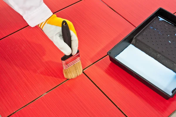 Brush primer grout of red tiles resistant — Stock Photo, Image