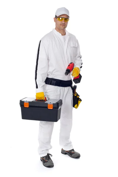 Construction worker in white coveralls with a tool box — Stock Photo, Image