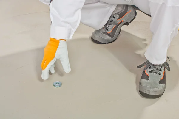 Metal disc for level measure of floor — Stock Photo, Image