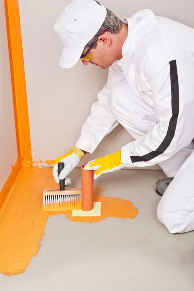 Plumber applied waterproofing cuff brush — Stock Photo, Image