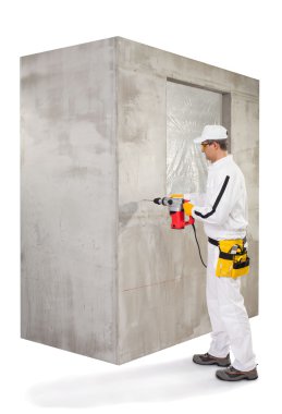 Worker making a hole with a perforator