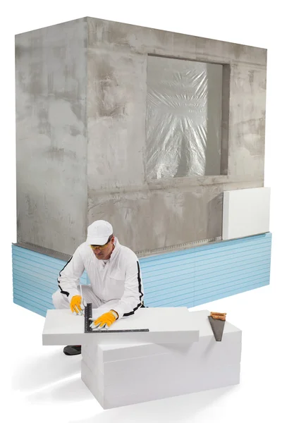 Worker measuring an insulation panel — Stock Photo, Image