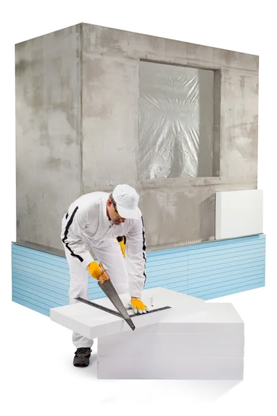 Worker sawing an insulation panel — Stock Photo, Image