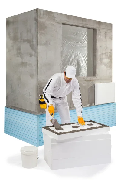 Worker spreading a lute on an insulation panel — Stock Photo, Image