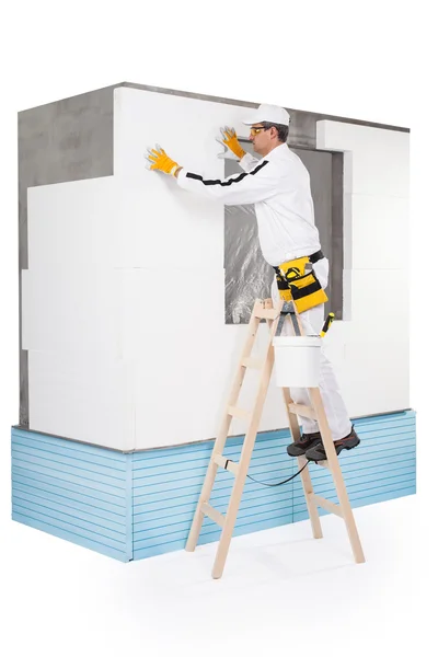 Worker fixing an insulation panel — Stock Photo, Image