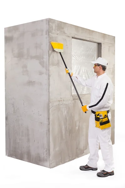 Worker cleaning the surface with a broomstick — Stock Photo, Image