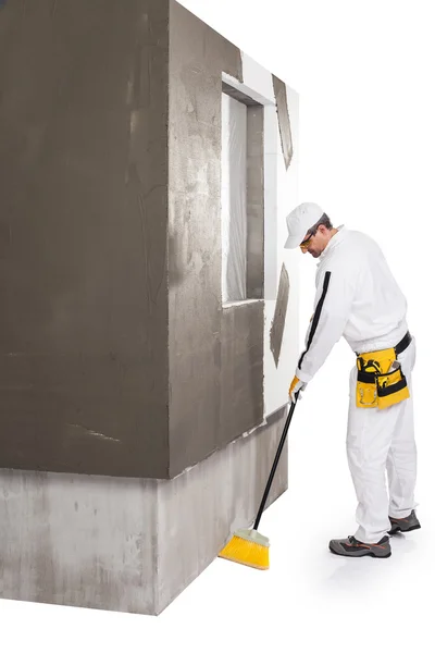 Worker cleaning with a broomstick — Stock Photo, Image