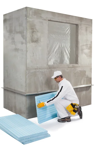 Worker setting up an insulation panel — Stock Photo, Image