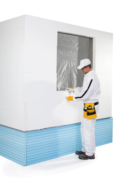 Worker fixing a small insulation panel — Stock Photo, Image