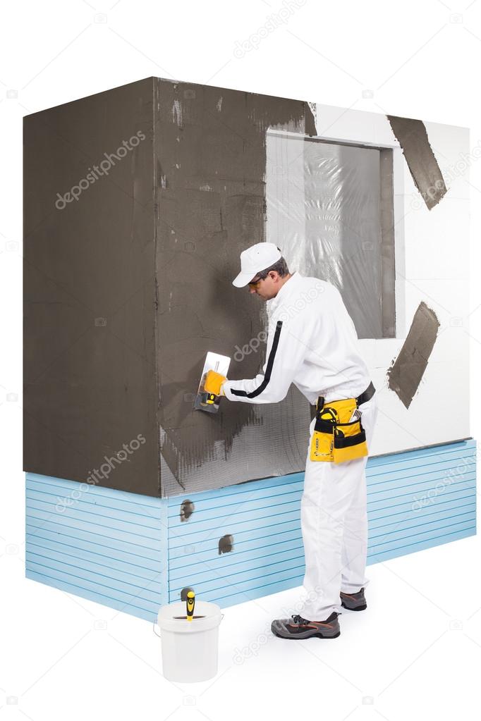 Worker spreading a putty