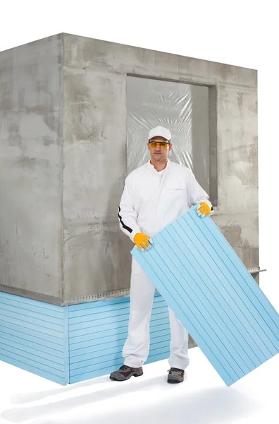 Trabalhador segurando um painel de isolamento — Fotografia de Stock