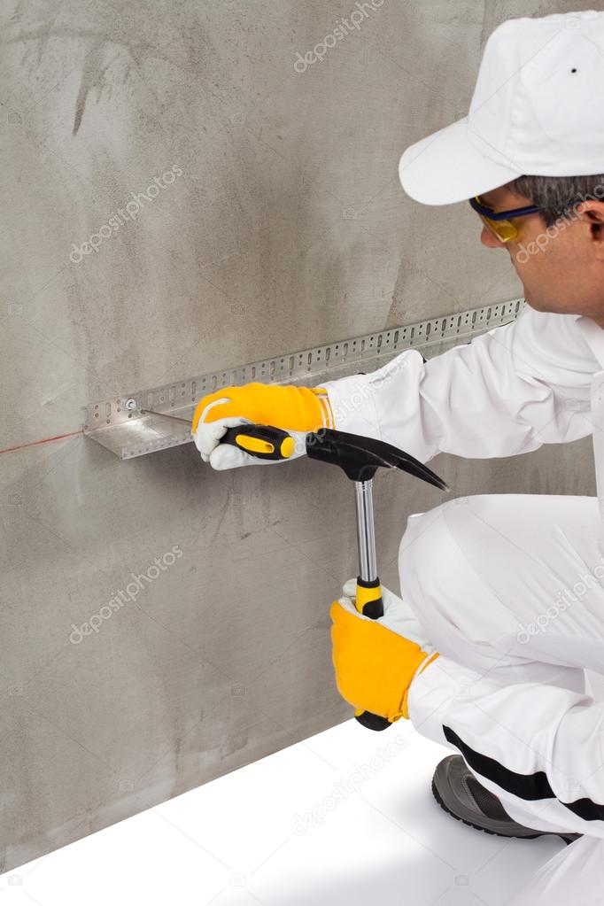 Worker using a dowel