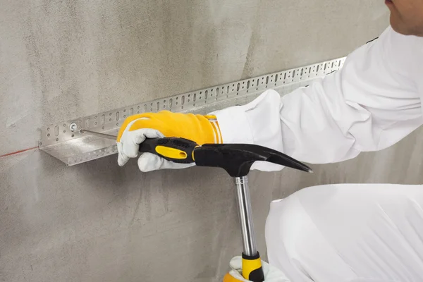 Worker fixing a dowel — Stock Photo, Image