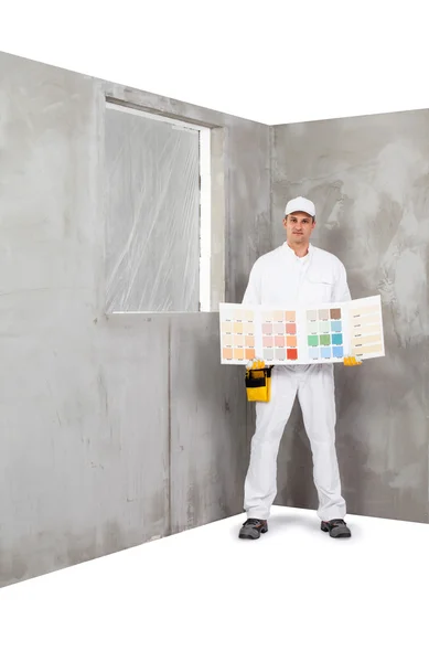 Εργάτης που κρατά ένα χρώμα παλέτας δειγμάτων — Φωτογραφία Αρχείου