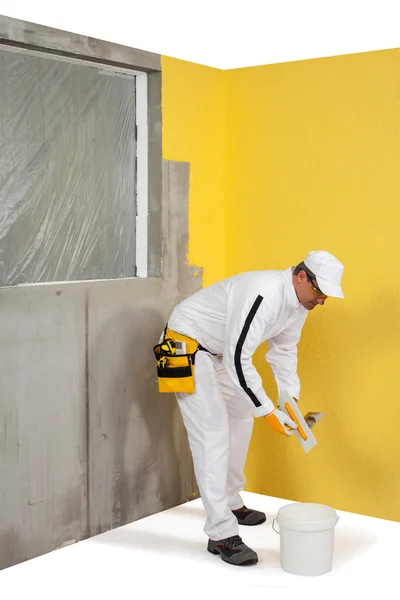 Worker in front of plastered wall — Stock Image Worker in front of plastered wall Royalty Free Stock Photos