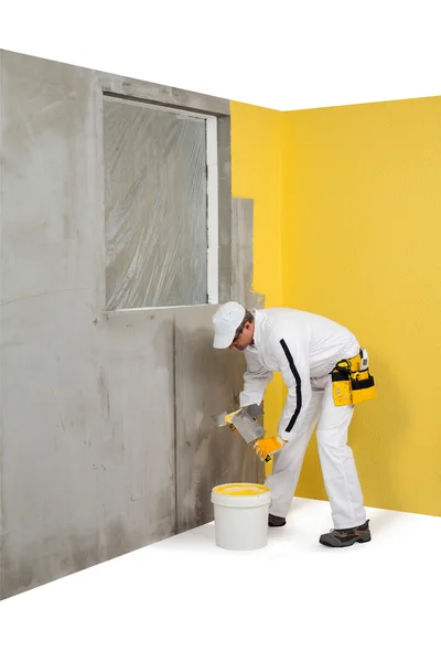 Worker getting a plaster from a pail — Stock Image Worker getting a plaster from a pail Royalty Free Stock Images