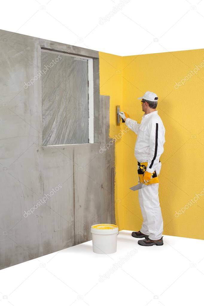 Worker spreading a plaster on a corner-wall