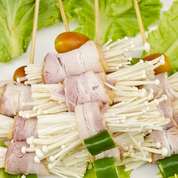 Enoki mushrooms wrapped with pork bacon, prepared for barbeque — Stock Photo, Image