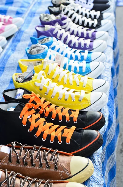 Lots of sneaker shoes on sale — Stock Photo, Image