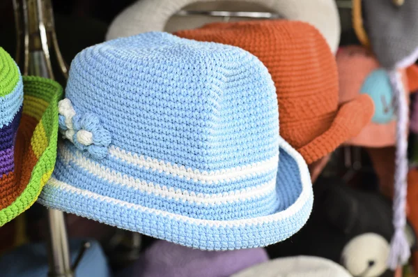 Hand knitted hats on display for sale — Stock Photo, Image