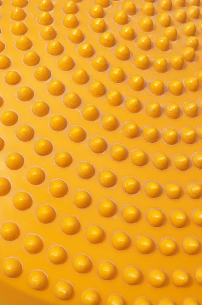 Abstrakte gepunktete orange Kunststoff Hintergrund — Stockfoto