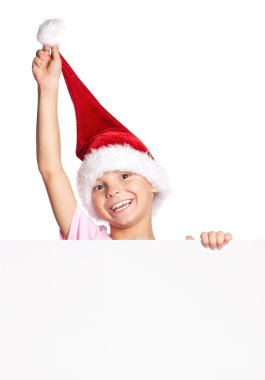 Noel Baba şapkalı küçük çocuk