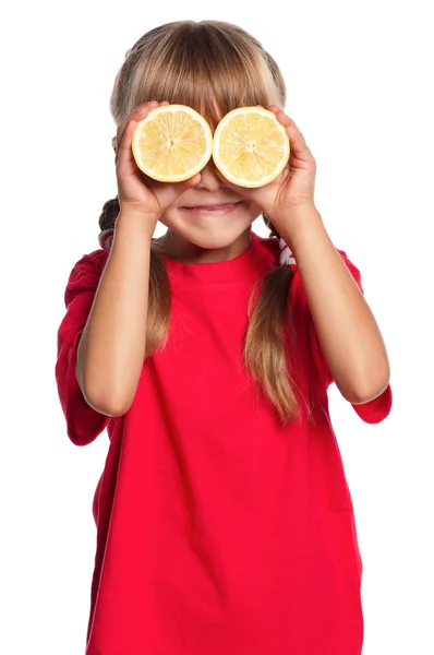 Little girl with lemon — Stock Photo, Image