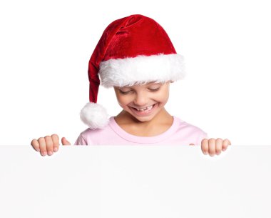 Noel Baba şapkalı küçük çocuk