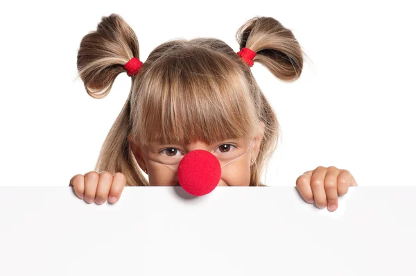 Menina com nariz de palhaço — Fotografia de Stock