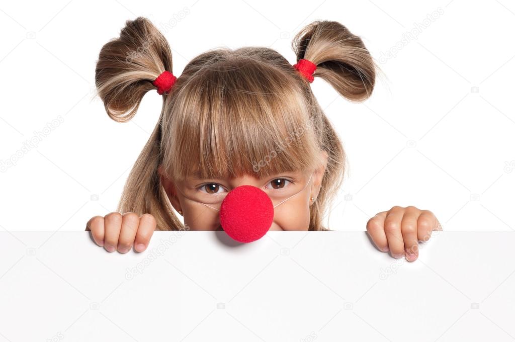Little girl with clown nose