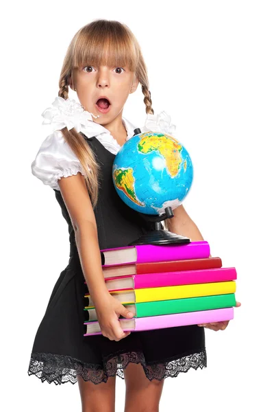 Kleines Mädchen mit Globus und Büchern — Stockfoto