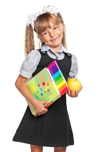 Kleines Mädchen mit Schulheften — Stockfoto