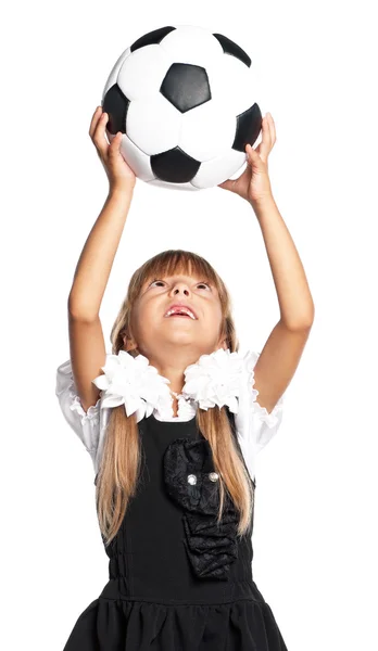 Маленька школярка з футбольним м'ячем — стокове фото