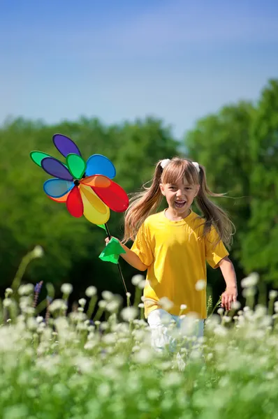 Happy girl with weathercock — Stock Photo, Image