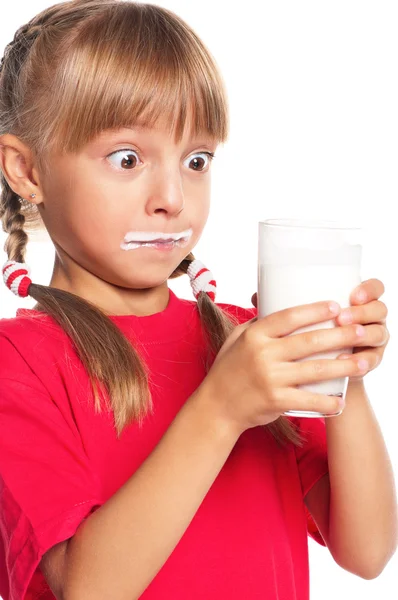 Holčička s sklenici mléka — Stock fotografie
