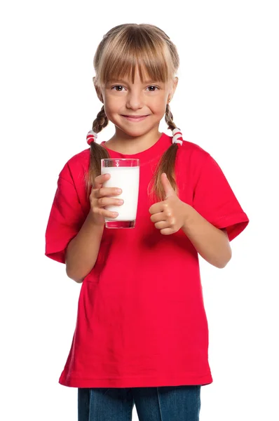 Holčička s sklenici mléka — Stock fotografie