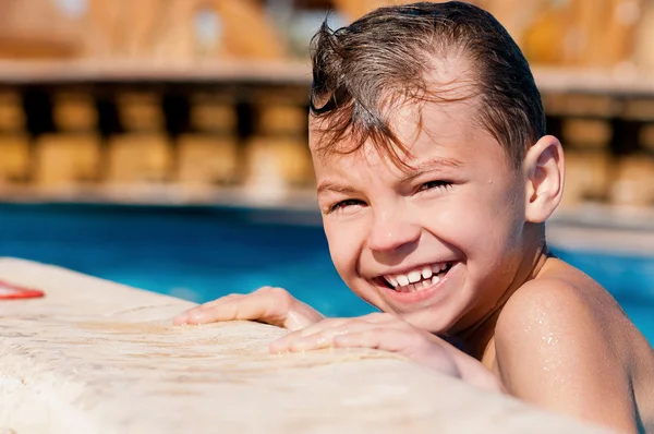 Boy in pool — Stock Photo, Image