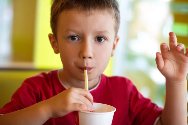 Little boy drinking juice — Stock Photo, Image