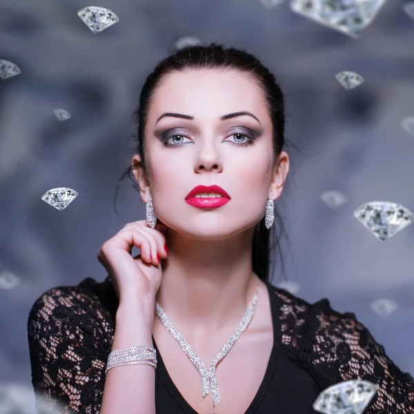 Woman with necklace and bracelet and earrings — Stock Photo, Image