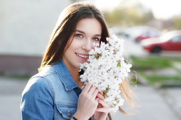 Happy woman smell cherry flower — Stock Photo, Image