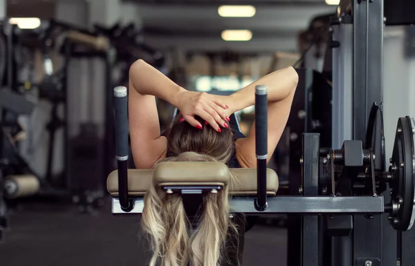 Blonde young woman give up workout in gym, fail